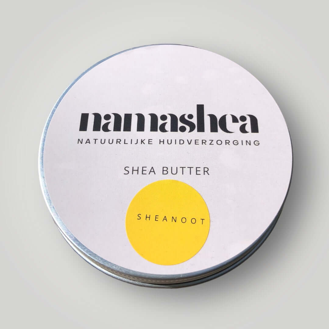 blik shea boter van Namashea op grijze achtergrond